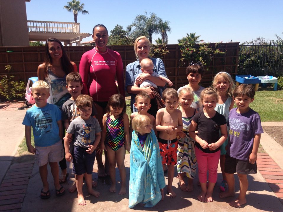 All the kids smiling in our day care swimming lessons with instructor Jane