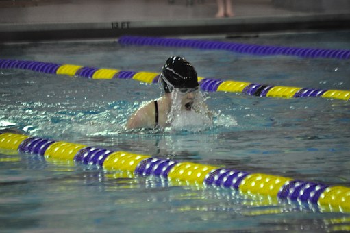 Female breaststroker perfecting her stroke.