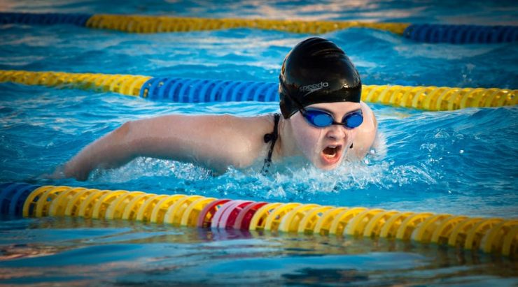 Adult swimming butterfly stroke