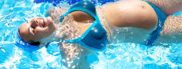 Pregnant Woman relaxing in the pool