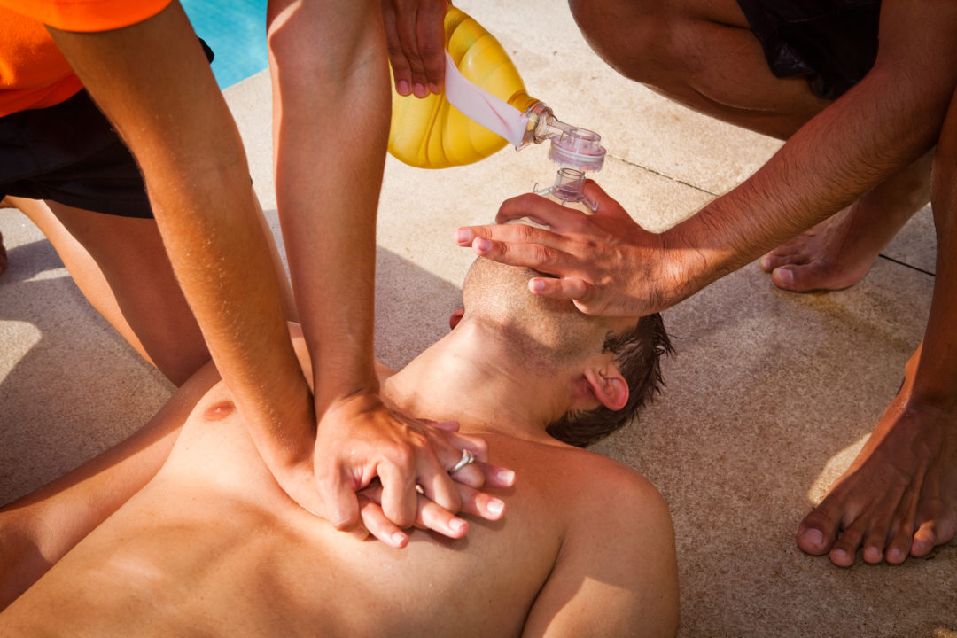 Two lifeguards giving CPR